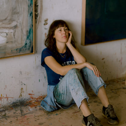 Photo of Amber Wallis sitting against wall