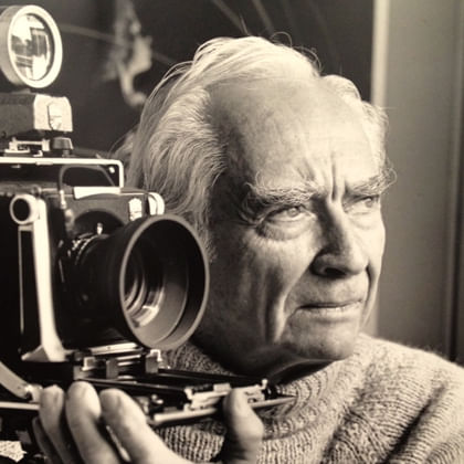 Photo of Max Dupain with his camera 