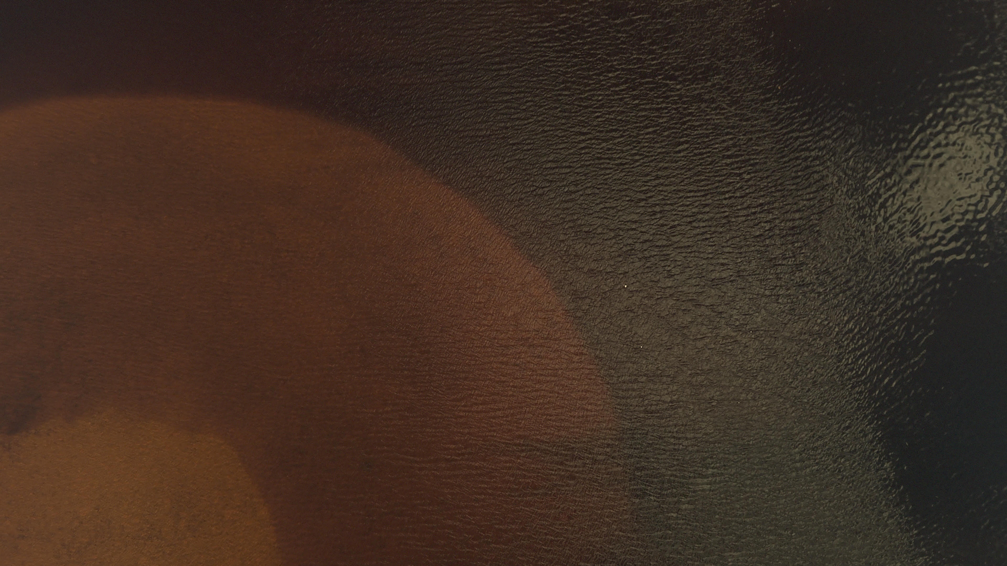 A brown and oche abstract image