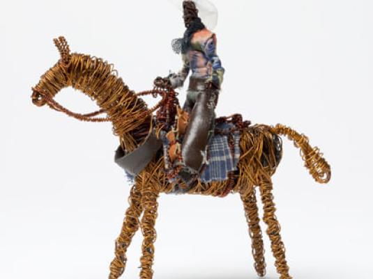 sculpture  of stockman on horse made from recycled materials and copper wire