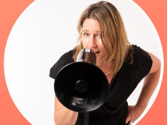 woman talking into megaphone