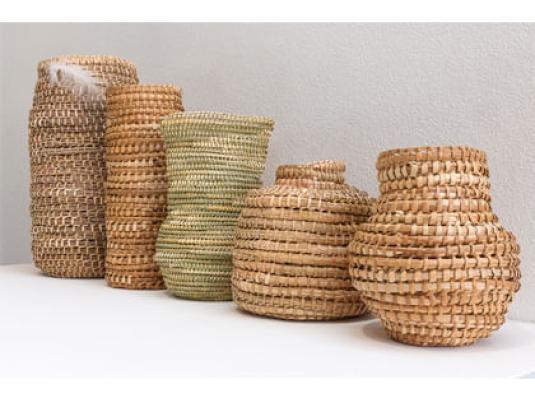 collection of baskets mad from Buchie Rush, Lomandra, Bull Rush, long leafed Pandanus, feather.