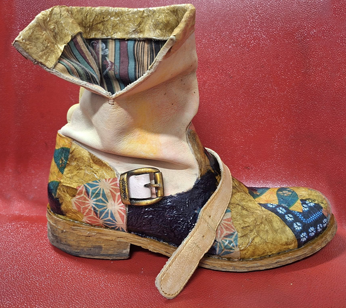 A boot that has been decoupaged