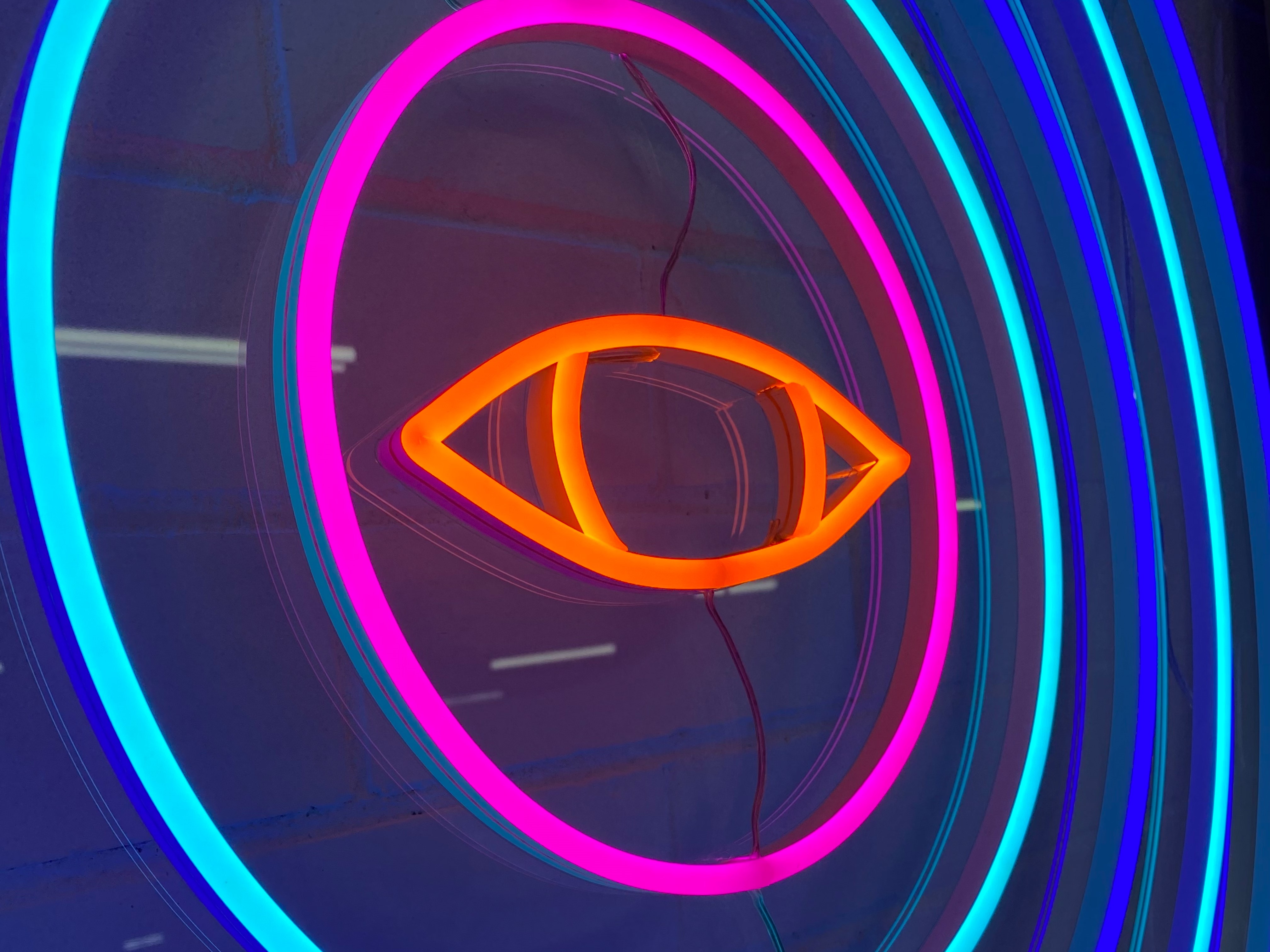 Neon light rings around a neon light eye