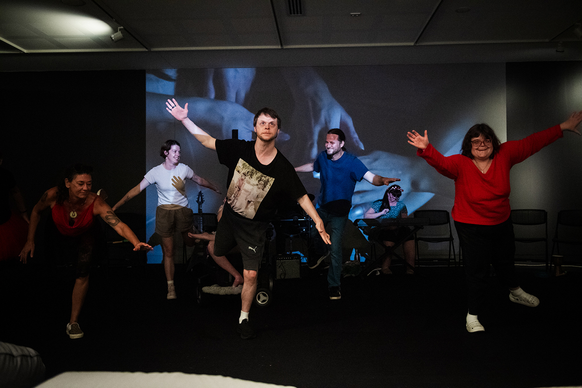 A groups of people with mixed ability dancing in the gallery