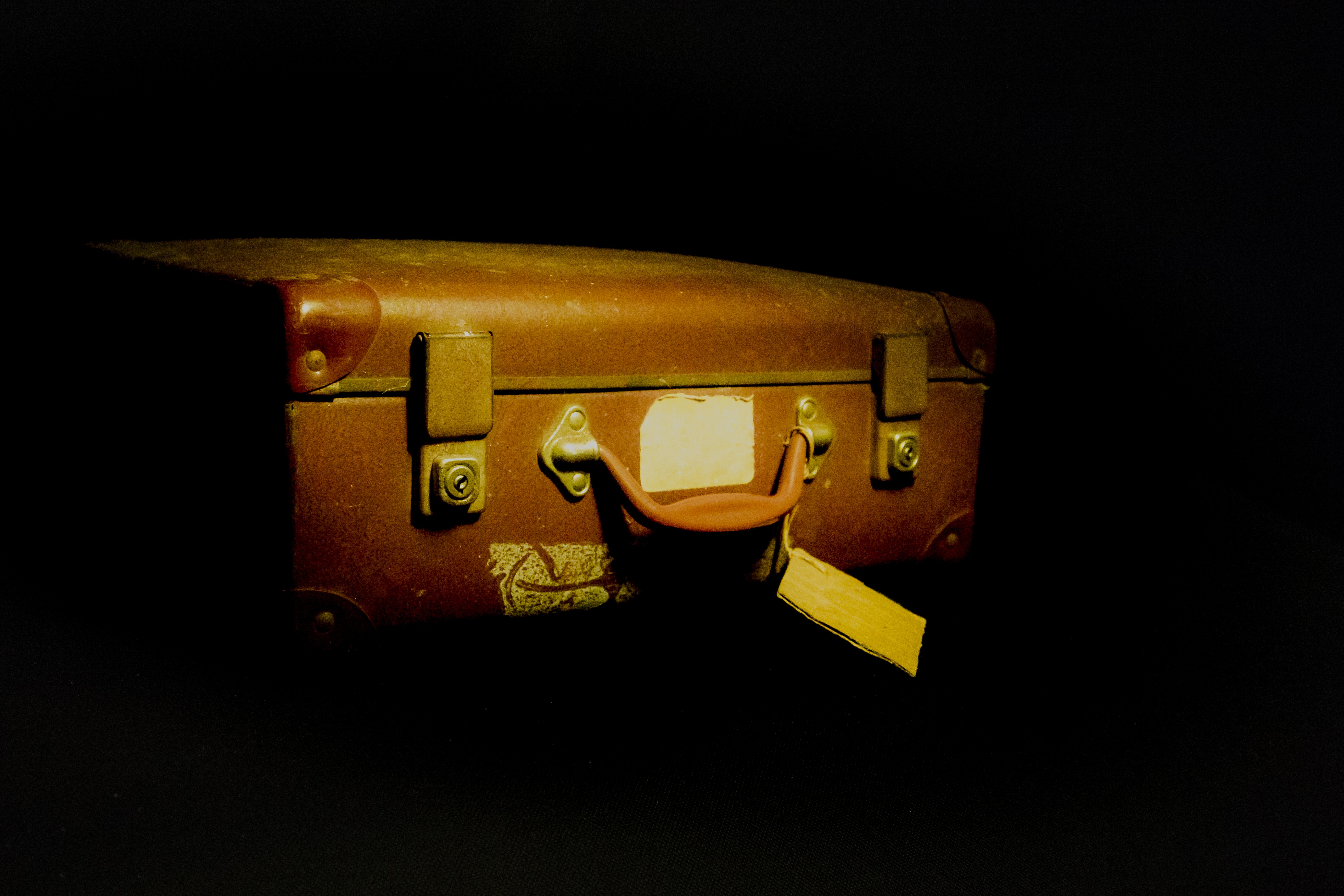 A suitcase with name tag attached