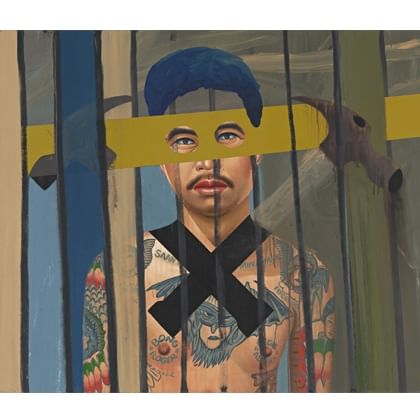 man behind bars with large black X across his tatooed chest