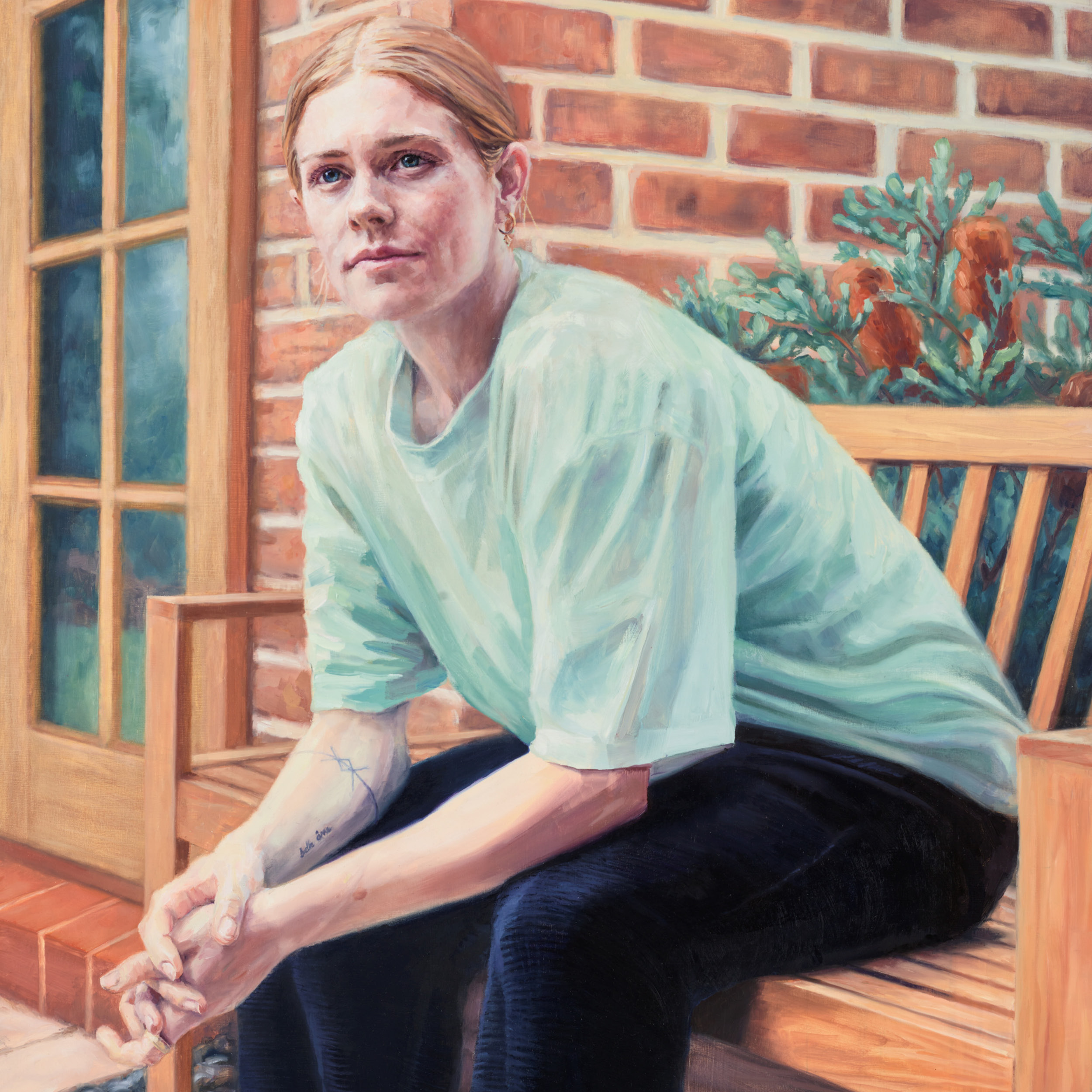 Courtnee Vine sitting on a bench