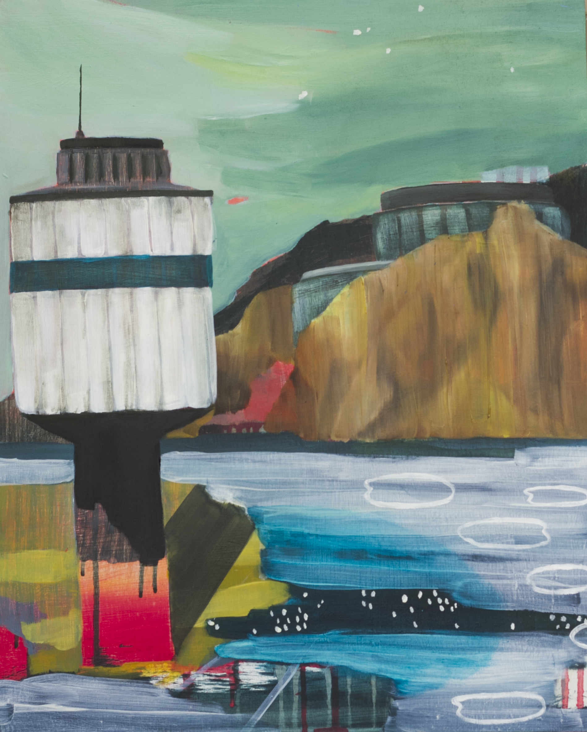 watchtower on shore with headland across the water in background