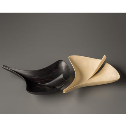 one black and one white forms in shape of ginkgo seeds