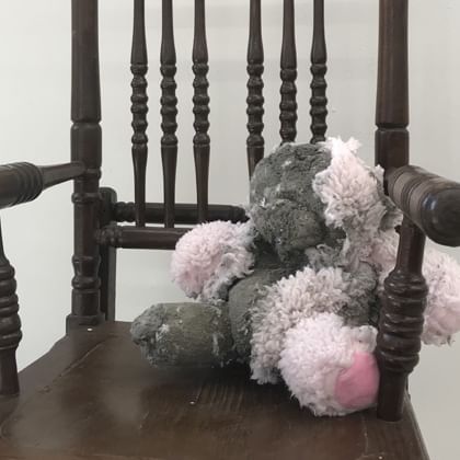 teddy bear in chair