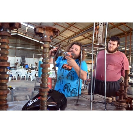 two artists creating work