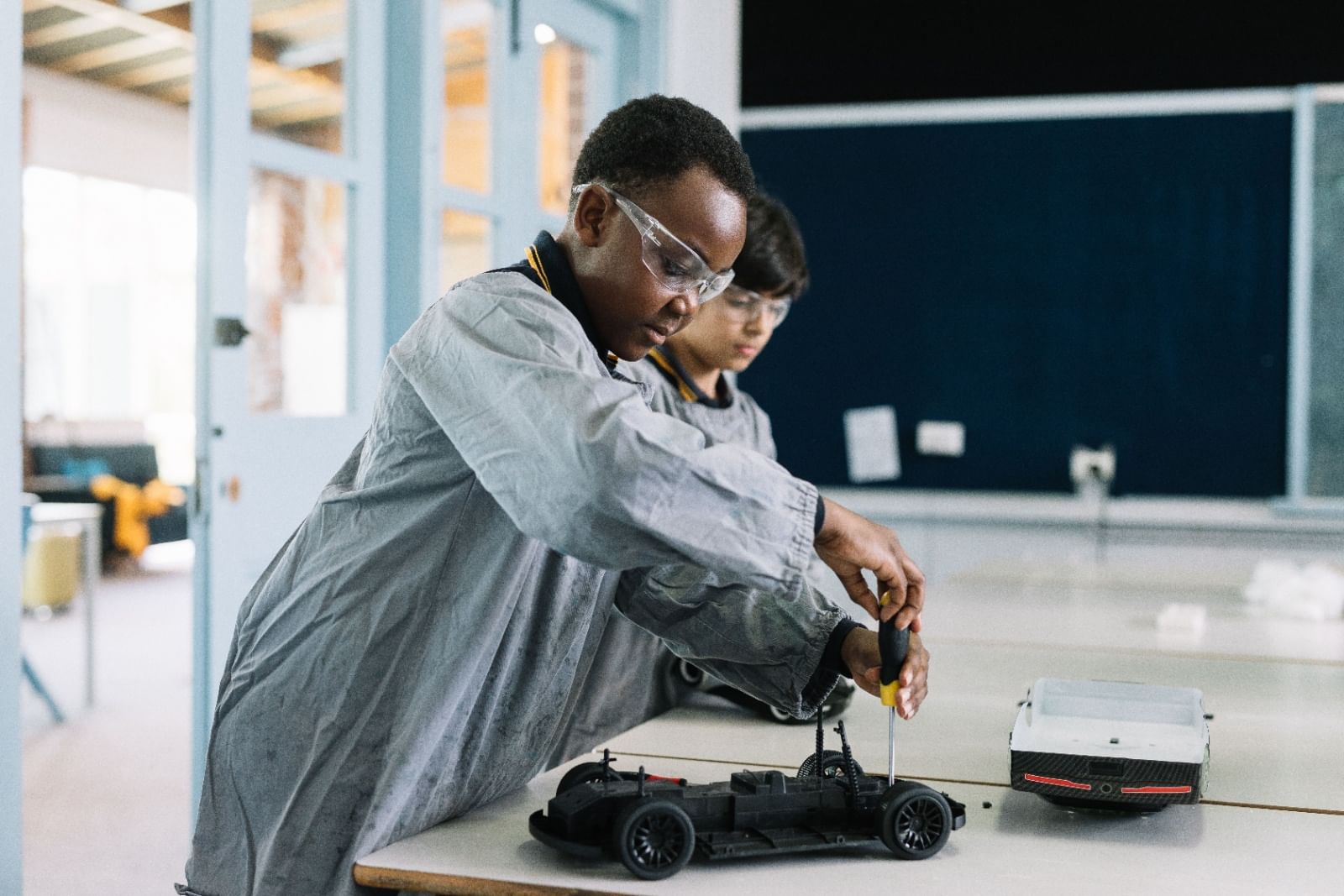 two children making toys