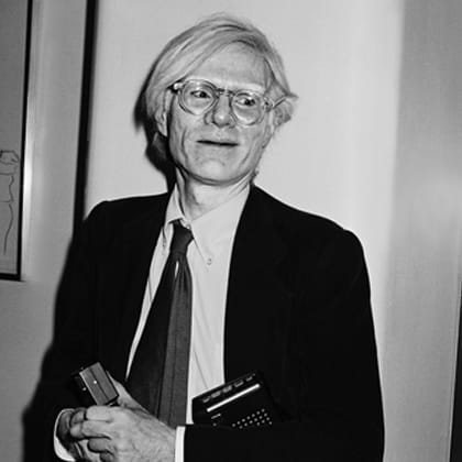 portrait of Andy Warhol in a suit and tie 