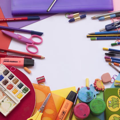 collection of art materials including pencils, paints, scissors, markers and stamps 