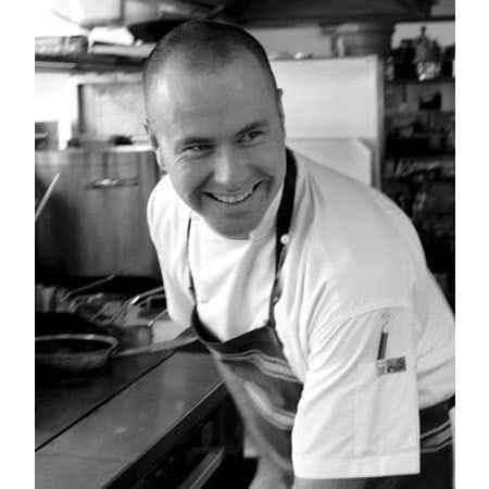 smiling chef in his kitchen 