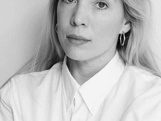 A black and white portrait of a woman