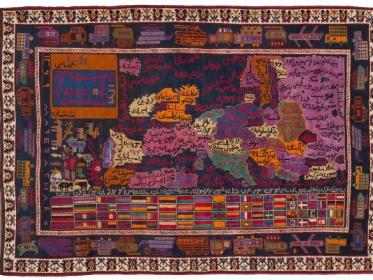 Woven map of Afganistan showing territories of occupying power with the flags of all the occupying nations