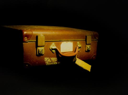 A suitcase with name tag attached