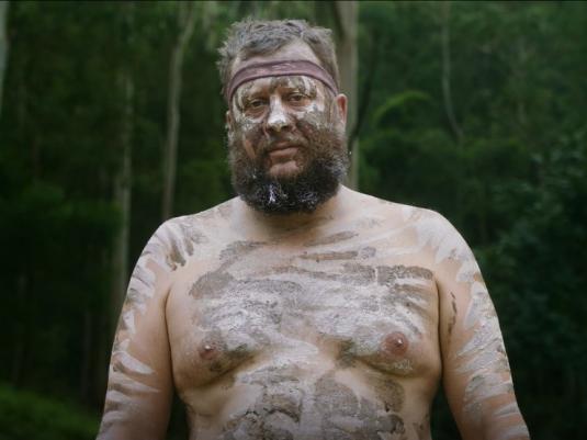 Aboriginal man from Wonnarua nation  with forest in the background