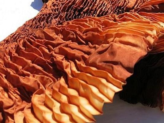 accordian folded fabric dyed with plant dyes