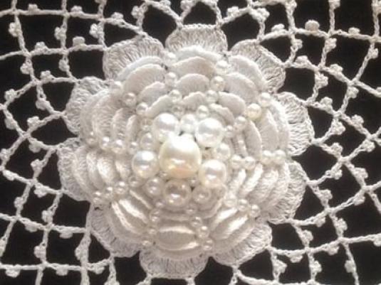 detail of crocheted flower