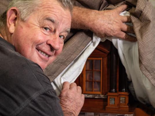 geoff hannah pulls back the covers to show a sneak preview of his latest piece of woodwork