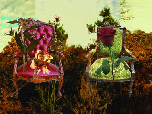2 upholstered chairs in front of dried landscape. There are flowers in front of the chairs - one is badly withered