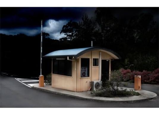 guardhouse in front of a stormy sky