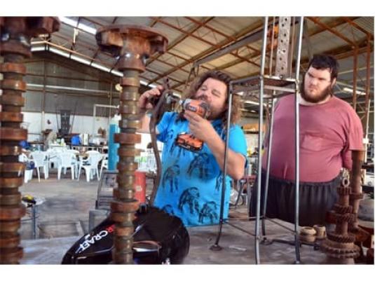 two artists creating work