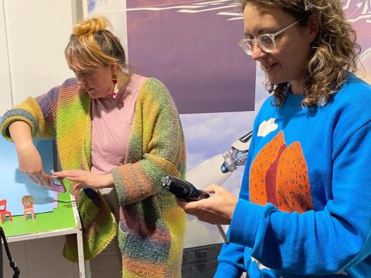 women working on artwork