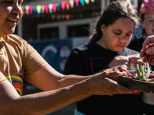 two women with offering bowl