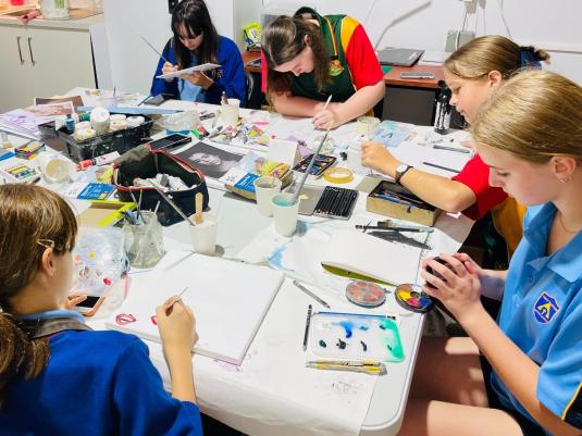 young people creating artwork