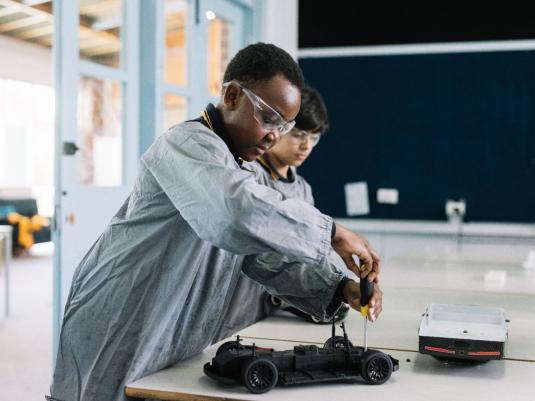 two children making toys