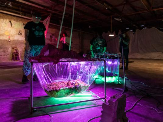 people looking at sculptures