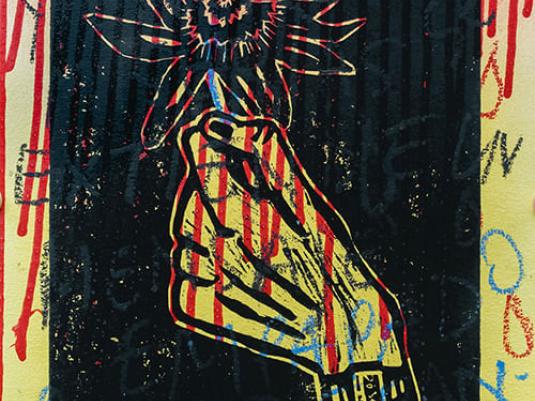 lino print of hand holding flower