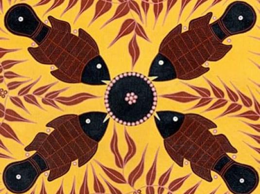 four fish facing circle in the centre of picture with vines between them all