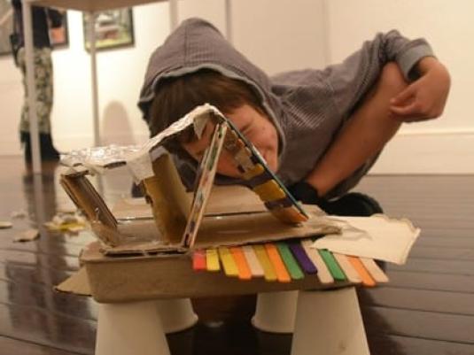 child with craft creation