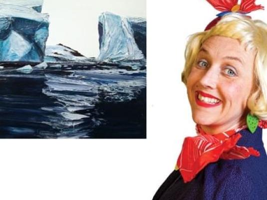 Peggy Popart next to painting of icebergs in the ocean