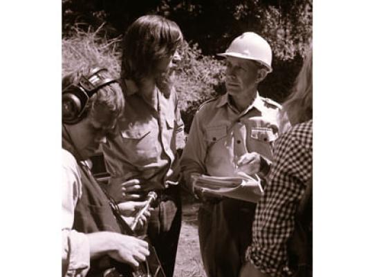David Kemp and Alex Floyd talking in front of journalists with the forest behind them