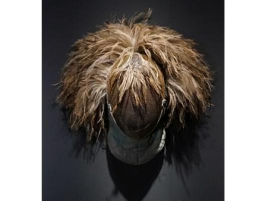 head shape object covered in blond/brown  unbrushed hair