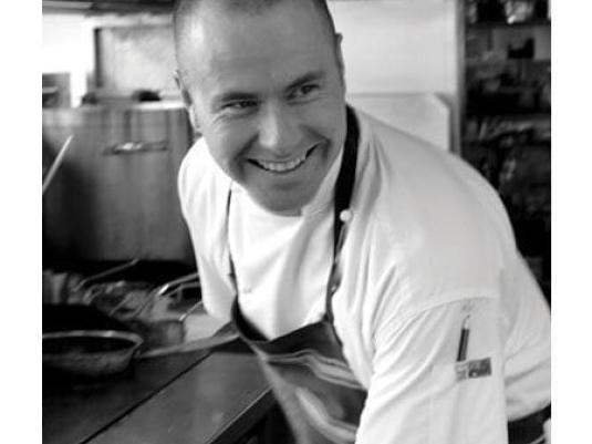 smiling chef in his kitchen